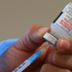 A nurse in Guatemala preparing a dose of the Moderna covid-19 vaccine at a vaccination center in San Juan Sacatepequez, Guatemala on July 15, 2021